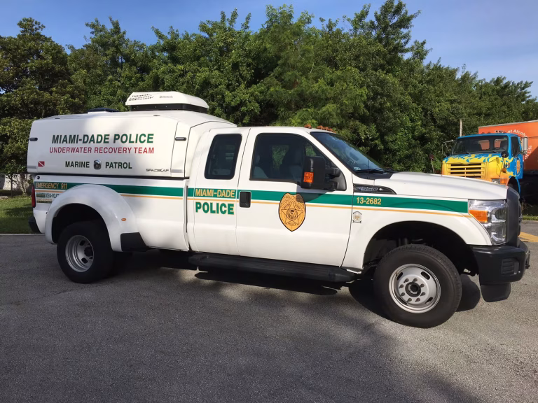 White Miami-Dade Police Underwater Recovery Team Marine Patrol truck parked on the street