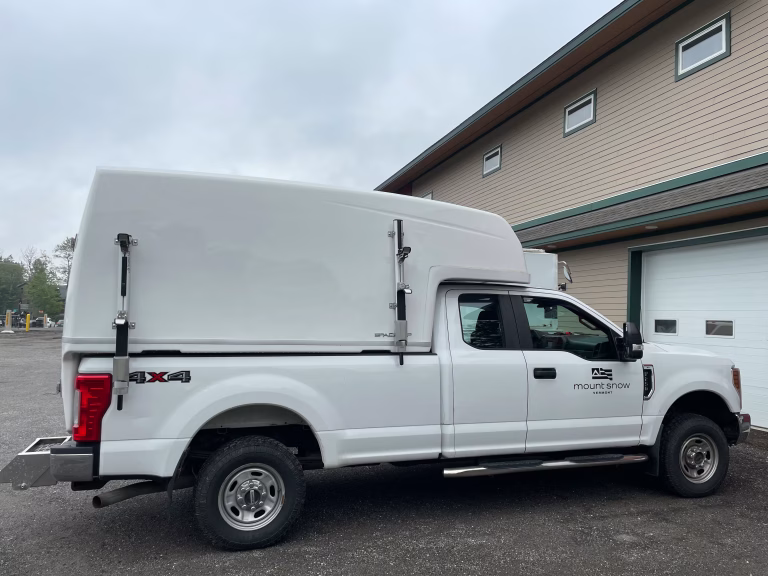 SpaceKap Diablo service body on a full-size pickup at a commercial building maintenance site