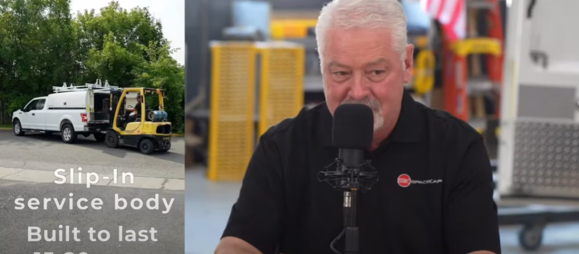 Man speaking into a microphone during a podcast or interview with an image of a slip-in service body truck and forklift in the background